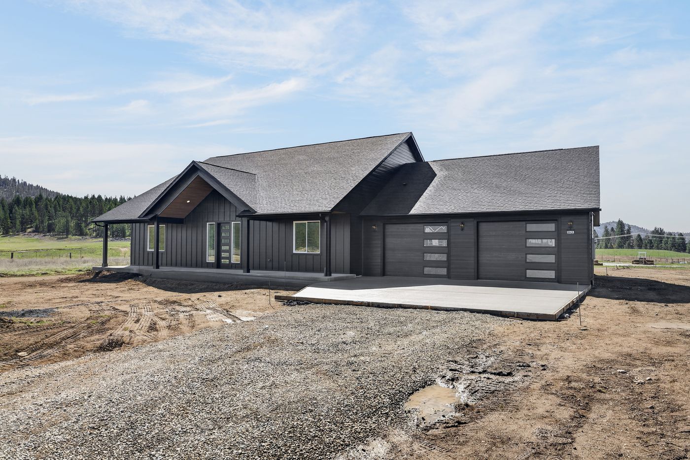 Completed dark board-and-batten Hardie re-side near Spokane