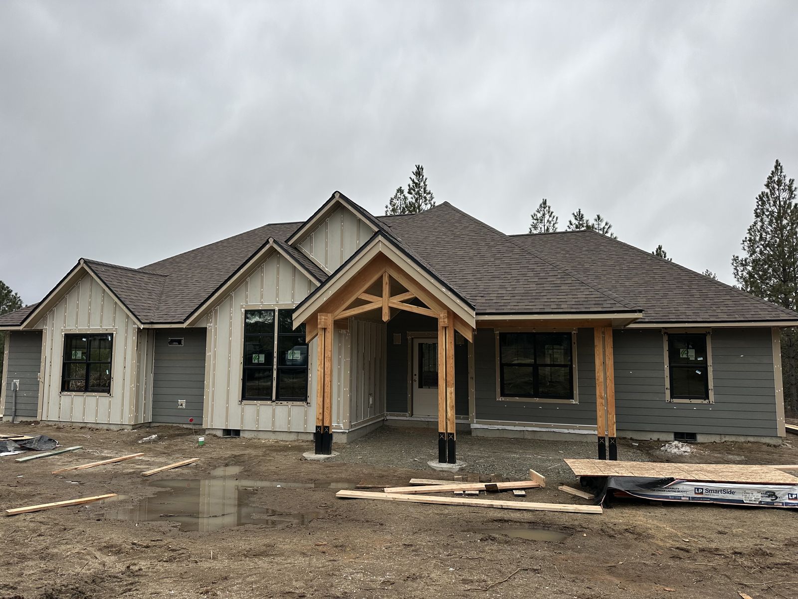 Greige ranch home with timber-frame entry near Medical Lake