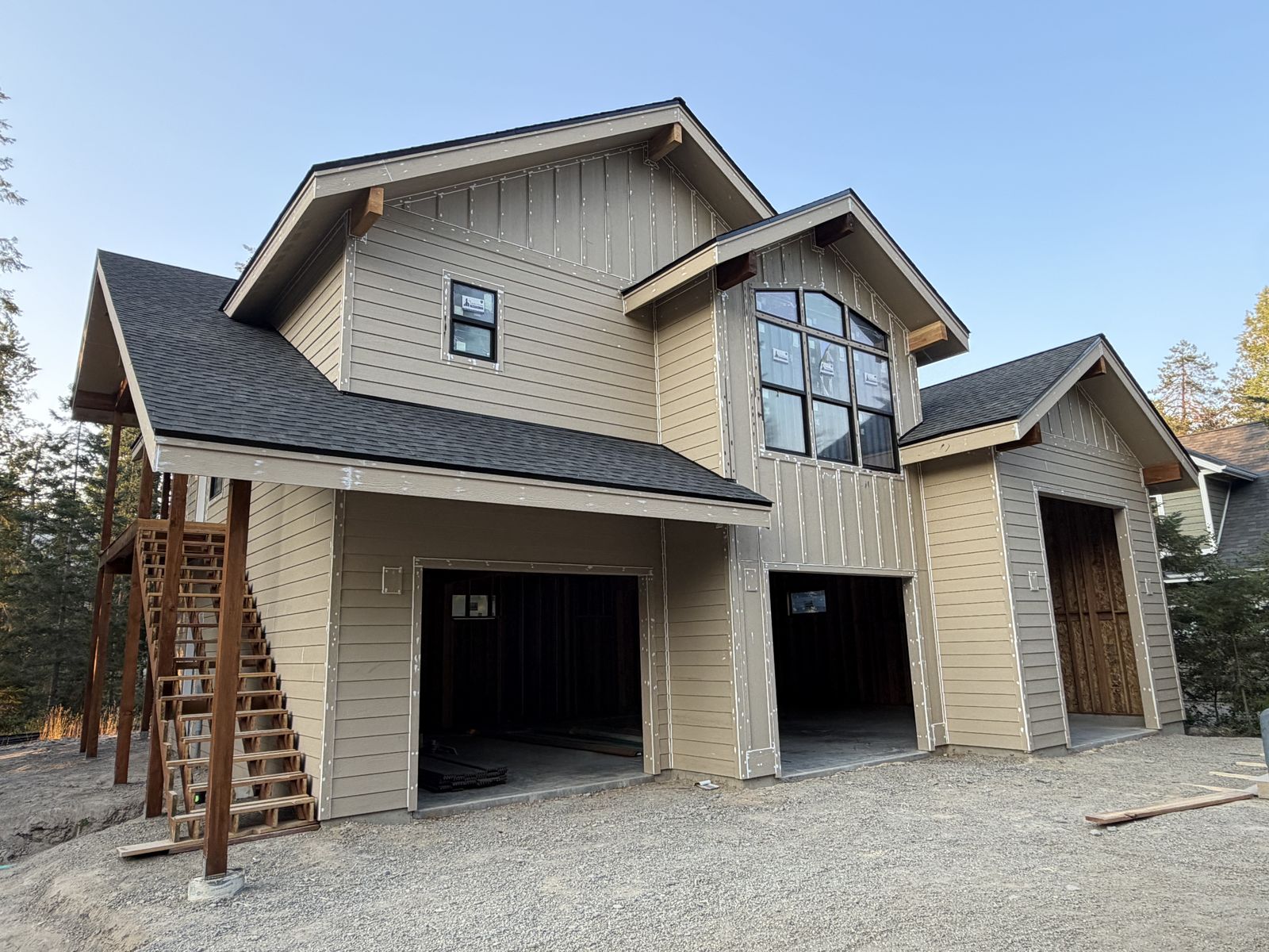 Tan garage and loft building with timber stairs near Spirit Lake